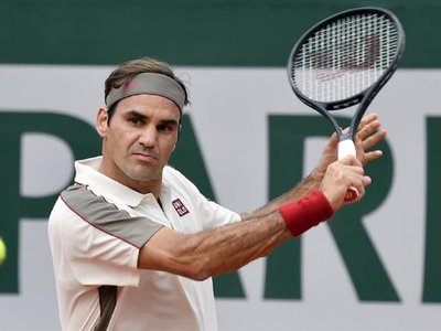 Federer celebra con un triunfo cómodo su partido 400 en Grand Slam