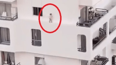 El espeluznante video de una niña caminando por la cornisa de un edificio