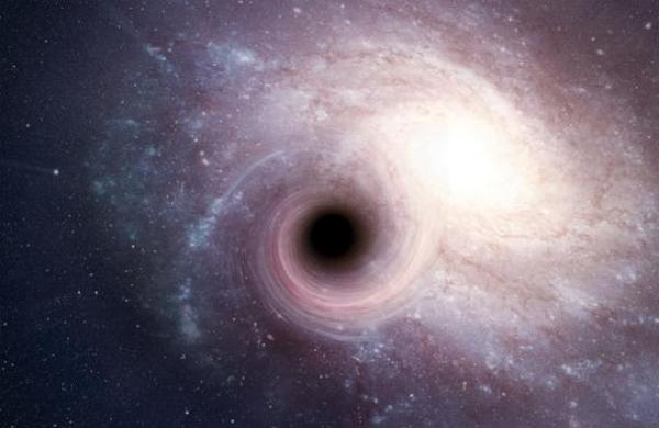 Hallan un agujero negro 'ultramasivo' que devora la masa del Sol a diario - SNT
