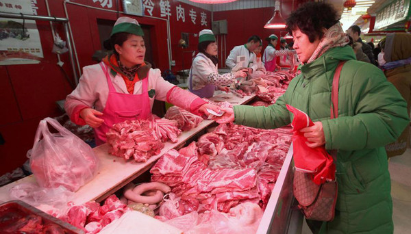 China pretende estabilizar producción y precios de cerdo con reservas