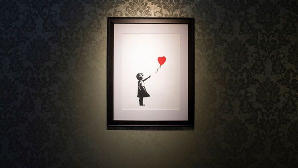 Subastan versión singular de Niña con globo firmada por Banksy