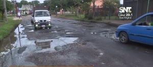 Calle minada de baches en San Lorenzo - SNT