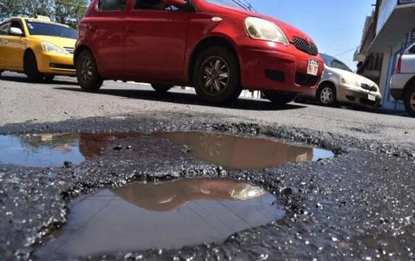Diputado propone indemnizar a quienes resulten afectados por los baches – Prensa 5
