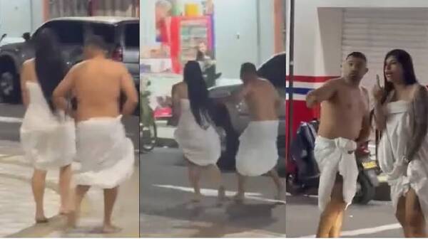 ¿Infieles pillados por la víctima?: una pareja fue vista corriendo en sábanas por las calles