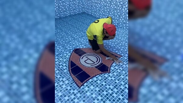 "Qué frío se va a sentir", dijo albañil de Guaraní al poner escudo de Cerro en piscina