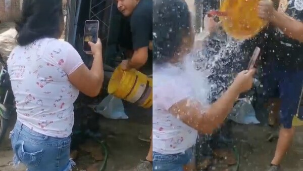 Dueño de lavadero le derramó agua a su vecina por reclamarle que estacionó un vehículo frente a su casa