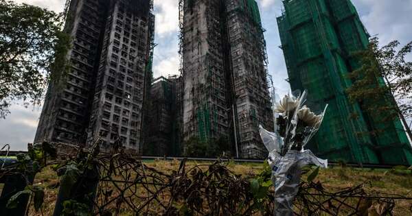 La Nación / Inspección de torres incendiadas en Hong Kong confirma 159 muertos