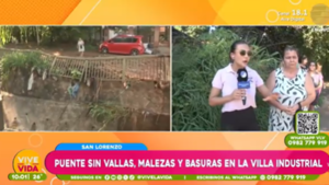 Puente sin vallas, malezas y basuras en San Lorenzo